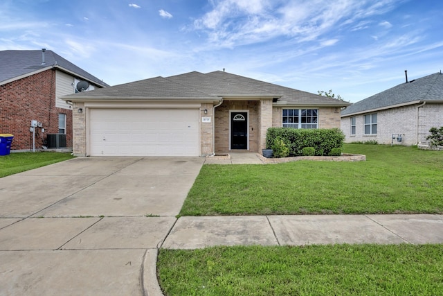 6717 Red Rock Trl, Watauga, TX 76137 - ranch-style house featuring concrete driveway, a front lawn, a garage, brick siding, and central air condition unit
