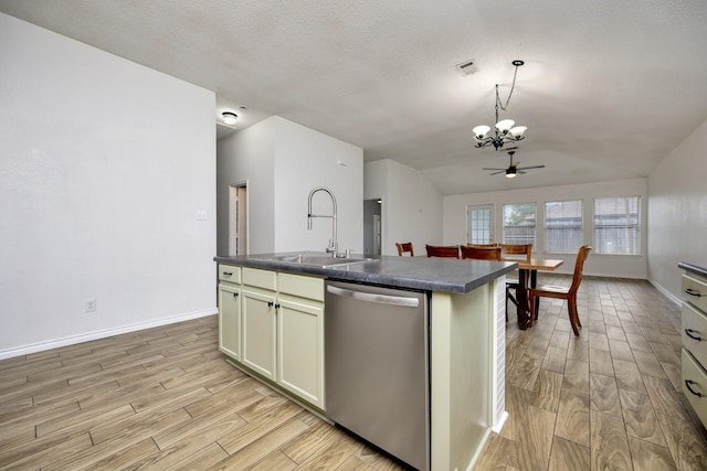 6717 Red Rock Trl, Watauga, TX 76137 - kitchen featuring dishwasher, a sink, dark countertops, a chandelier, and lofted ceiling