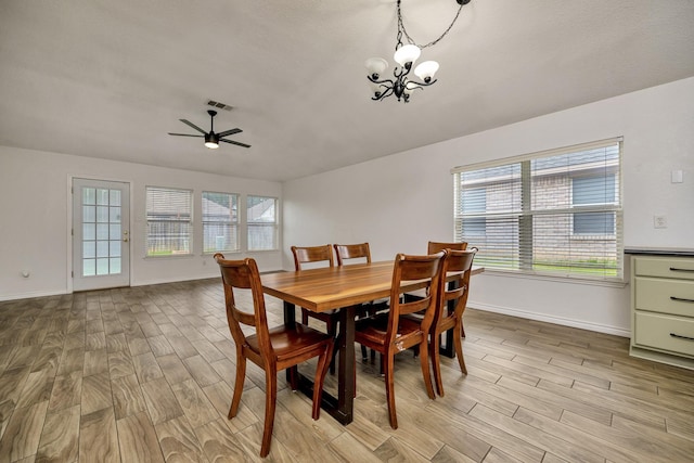 6717 Red Rock Trl, Watauga, TX 76137 - dining space featuring light wood-type flooring, baseboards, a chandelier, and ceiling fan