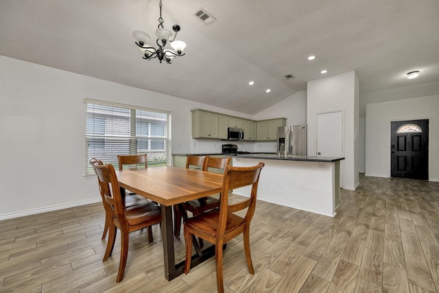 6717 Red Rock Trl, Watauga, TX 76137 - dining space featuring a chandelier, light wood finished floors, vaulted ceiling, baseboards, and recessed lighting