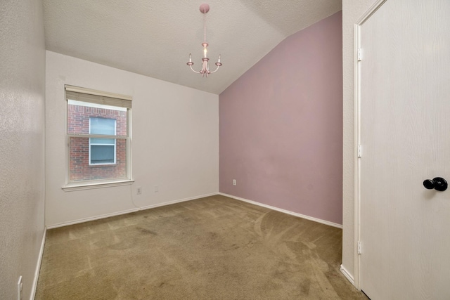 6717 Red Rock Trl, Watauga, TX 76137 - carpeted spare room with vaulted ceiling, a chandelier, and baseboards