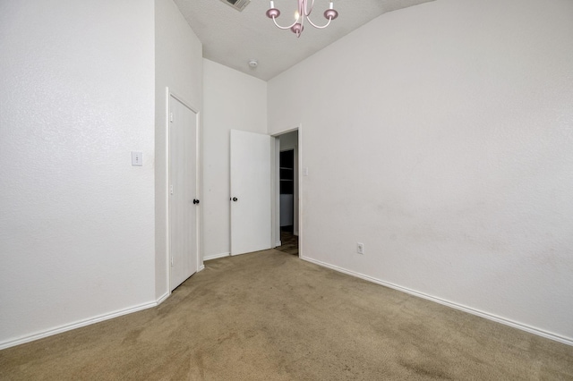 6717 Red Rock Trl, Watauga, TX 76137 - unfurnished bedroom featuring carpet, a chandelier, vaulted ceiling, and baseboards