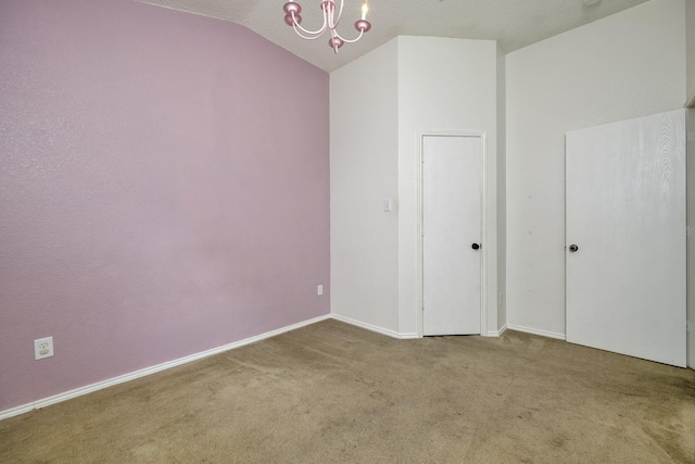 6717 Red Rock Trl, Watauga, TX 76137 - empty room featuring a chandelier, carpet flooring, vaulted ceiling, and baseboards