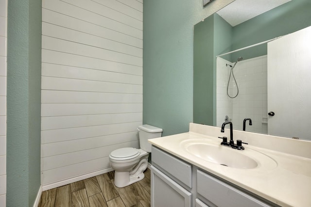 6717 Red Rock Trl, Watauga, TX 76137 - full bathroom featuring toilet, a shower, wood finished floors, and vanity
