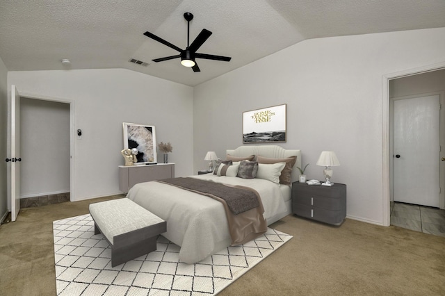 6717 Red Rock Trl, Watauga, TX 76137 - bedroom with vaulted ceiling, light carpet, a textured ceiling, ceiling fan, and baseboards