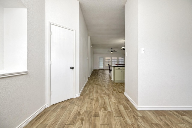 6717 Red Rock Trl, Watauga, TX 76137 - hallway with light wood-type flooring and baseboards