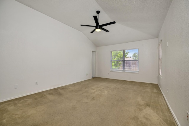6717 Red Rock Trl, Watauga, TX 76137 - carpeted spare room featuring lofted ceiling, a ceiling fan, and baseboards