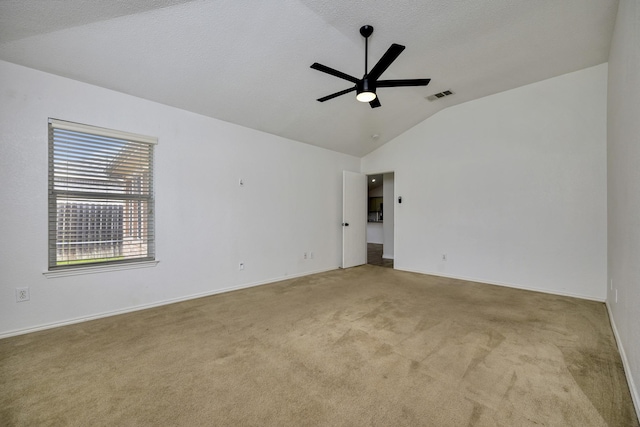6717 Red Rock Trl, Watauga, TX 76137 - carpeted spare room featuring lofted ceiling, a ceiling fan, and baseboards