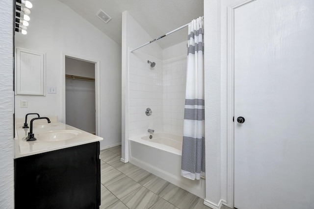 6717 Red Rock Trl, Watauga, TX 76137 - full bath with lofted ceiling, shower / bathtub combination with curtain, double vanity, and tile patterned flooring
