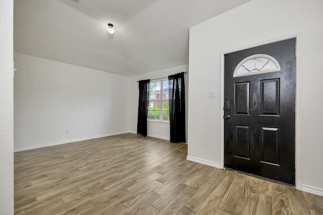 6717 Red Rock Trl, Watauga, TX 76137 - foyer featuring light wood-style flooring and baseboards