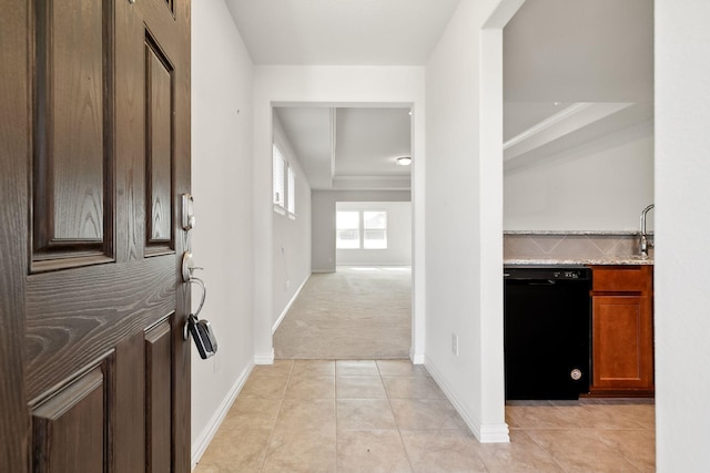 7672 Monument Dr, Little Elm, TX 76227 - entrance foyer with light tile patterned floors, baseboards, light colored carpet, and a raised ceiling