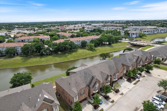 aerial view of residential area with a large body of water