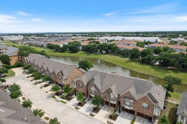 aerial perspective of suburban area featuring a nearby body of water