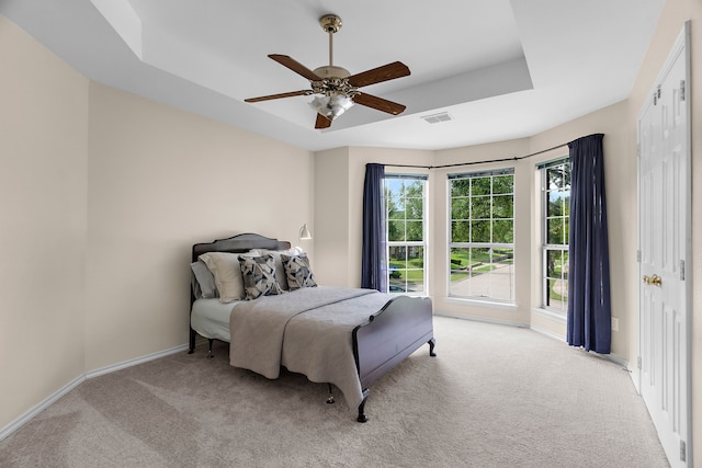 2830 Faversham Dr, Richardson, TX 75082 - bedroom featuring light carpet, baseboards, a tray ceiling, and a ceiling fan
