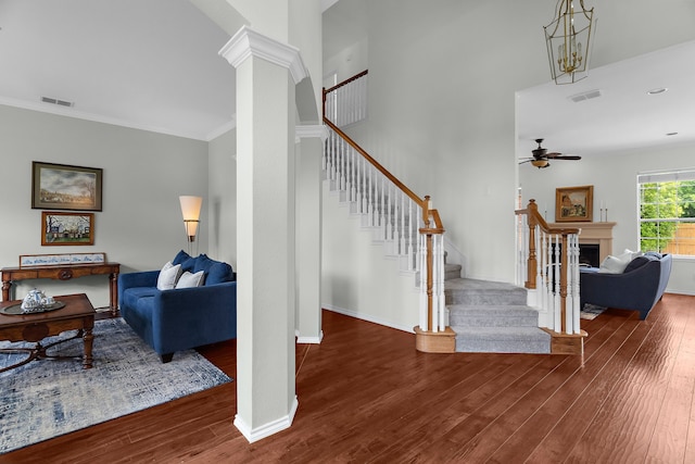 2830 Faversham Dr, Richardson, TX 75082 - stairs with a ceiling fan, wood finished floors, ornamental molding, baseboards, and decorative columns