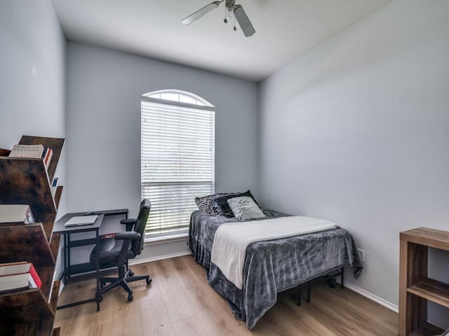 305 Rustic Meadows Dr, Royse City, TX 75189 - bedroom with wood finished floors, an office area, a ceiling fan, and baseboards