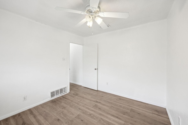2115 Southridge Dr, Arlington, TX 76010 - empty room featuring wood finished floors, ceiling fan, and baseboards