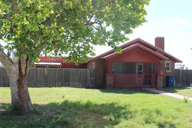 260 S Munday Ave, Munday, TX 76371 - view of side of home with brick siding and a chimney