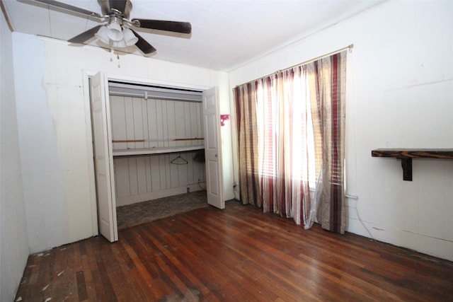 260 S Munday Ave, Munday, TX 76371 - unfurnished bedroom with wood finished floors and ceiling fan
