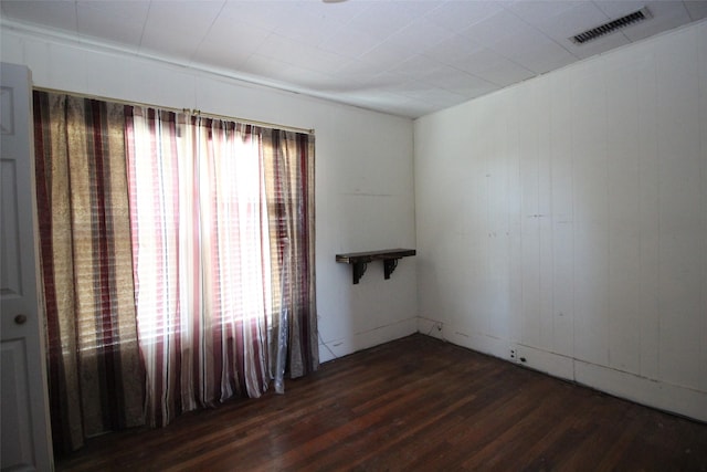 260 S Munday Ave, Munday, TX 76371 - spare room featuring dark wood-style floors
