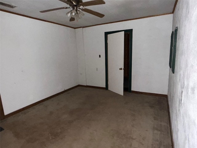 260 S Munday Ave, Munday, TX 76371 - unfurnished room with ornamental molding, carpet floors, ceiling fan, and baseboards