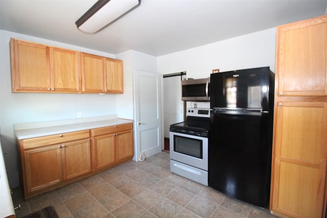260 S Munday Ave, Munday, TX 76371 - kitchen featuring stainless steel appliances and light countertops