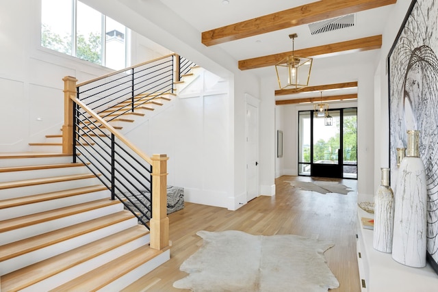 1405 Ridge Cir, Westlake, TX 76262 - entrance foyer featuring wood finished floors, stairway, beam ceiling, and baseboards