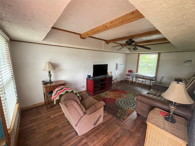 living room with a textured ceiling, wood finished floors, a textured wall, ceiling fan, and baseboards