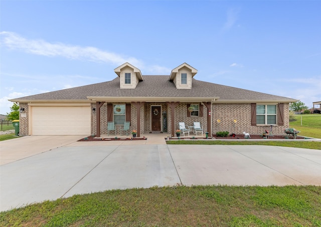 239 Springwood Ranch Loop, Springtown, TX 76082 - view of front facade featuring brick siding, covered porch, an attached garage, and driveway