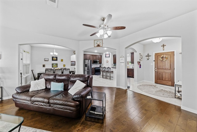 239 Springwood Ranch Loop, Springtown, TX 76082 - living area with arched walkways, hardwood / wood-style floors, a ceiling fan, and baseboards