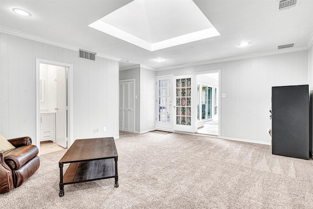 unfurnished living room with crown molding, recessed lighting, carpet, and a tray ceiling