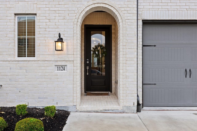 1124 Queensdown Way, Forney, TX 75126 - doorway to property featuring brick siding and an attached garage