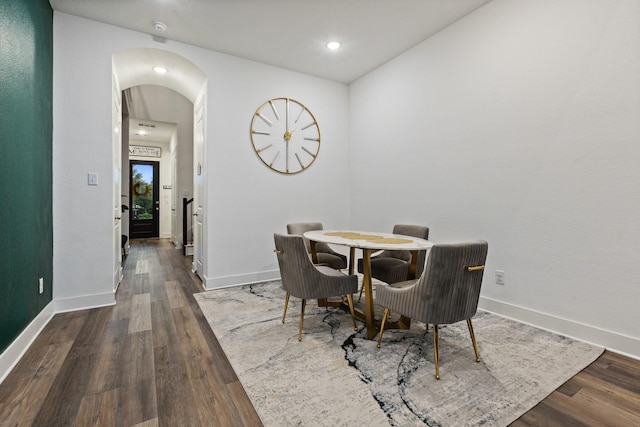 1124 Queensdown Way, Forney, TX 75126 - dining space with arched walkways, dark wood-style floors, baseboards, and recessed lighting