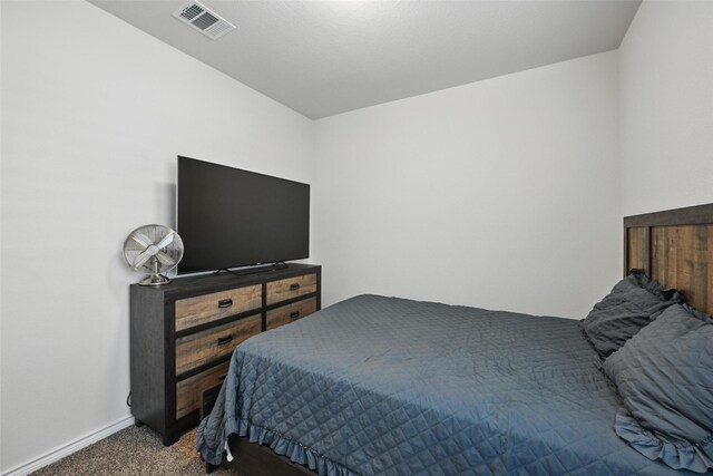 carpeted bedroom featuring baseboards
