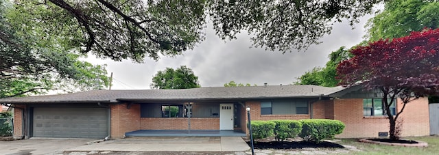 5828 Cynthia Cir, North Richland Hills, TX 76117 - ranch-style house with an attached garage, brick siding, and driveway