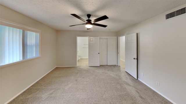 5828 Cynthia Cir, North Richland Hills, TX 76117 - unfurnished bedroom with carpet flooring, a textured ceiling, baseboards, a closet, and ensuite bathroom