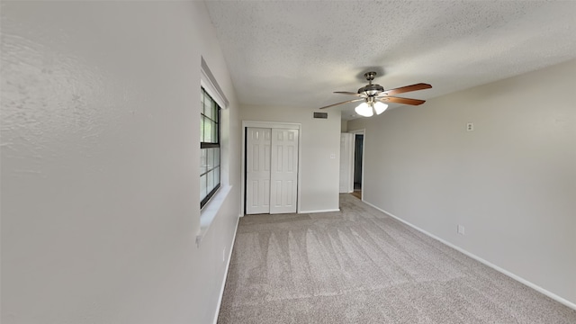 5828 Cynthia Cir, North Richland Hills, TX 76117 - unfurnished bedroom with a textured ceiling, a closet, carpet, baseboards, and ceiling fan