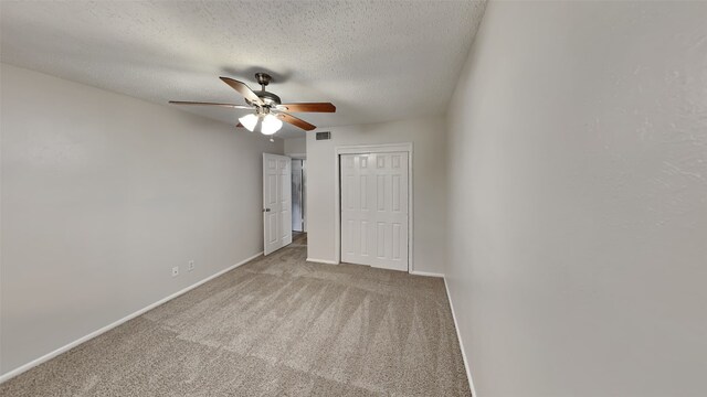 5828 Cynthia Cir, North Richland Hills, TX 76117 - unfurnished bedroom with a closet, baseboards, carpet flooring, a textured ceiling, and a ceiling fan
