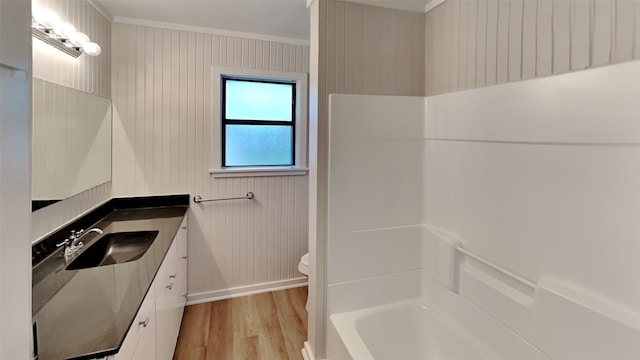 5828 Cynthia Cir, North Richland Hills, TX 76117 - full bath with wood finished floors, toilet, crown molding, vanity, and baseboards