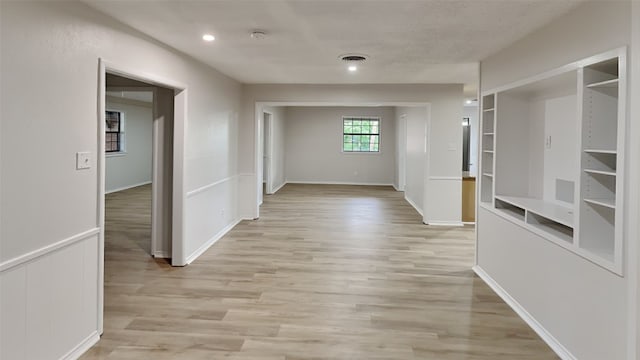5828 Cynthia Cir, North Richland Hills, TX 76117 - corridor with light wood-type flooring and built in features