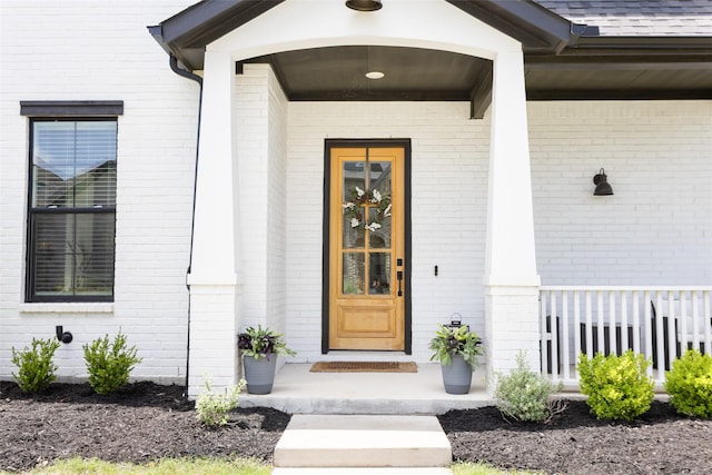 3545 W Cheney Ave, Celina, TX 75009 - view of exterior entry featuring brick siding and a porch