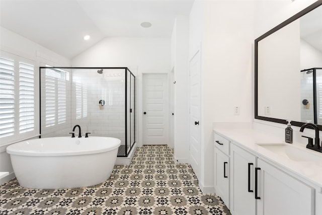 3545 W Cheney Ave, Celina, TX 75009 - full bathroom with lofted ceiling, a stall shower, vanity, a freestanding bath, and recessed lighting