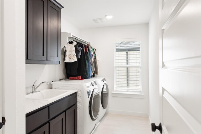 3545 W Cheney Ave, Celina, TX 75009 - laundry room featuring cabinet space, separate washer and dryer, and baseboards