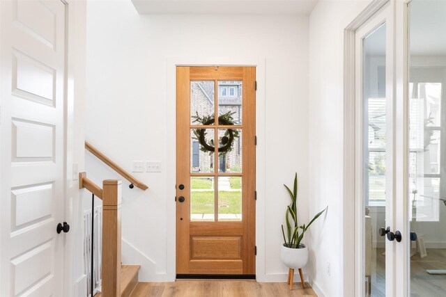 3545 W Cheney Ave, Celina, TX 75009 - doorway to outside with plenty of natural light, light wood finished floors, baseboards, and french doors