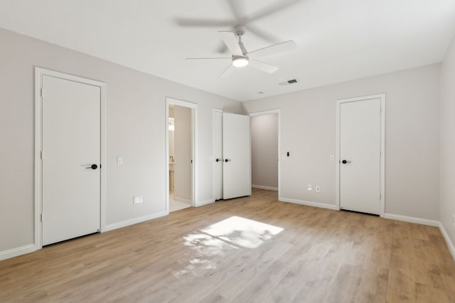 unfurnished bedroom featuring light wood finished floors and baseboards