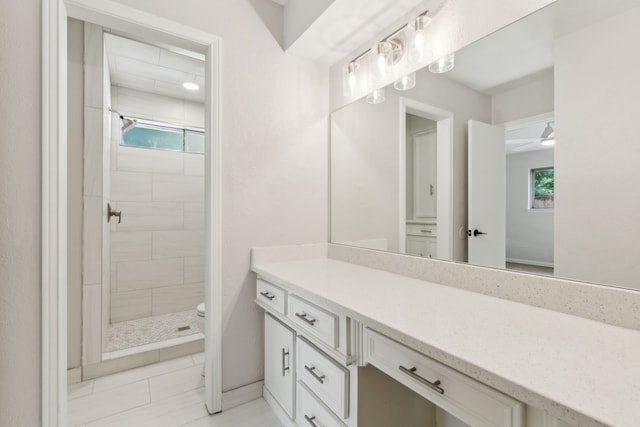 full bathroom featuring a shower stall, toilet, vanity, and tile patterned flooring
