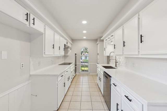 kitchen featuring a sink, dishwasher, tasteful backsplash, light countertops, and recessed lighting