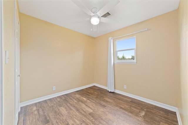 unfurnished room with wood finished floors, baseboards, and ceiling fan