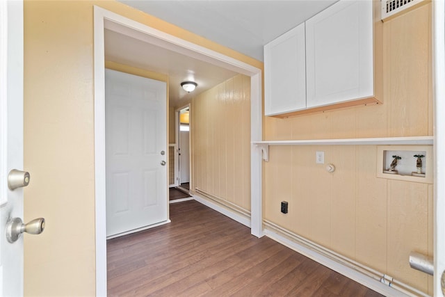 laundry area featuring hookup for a washing machine, cabinet space, and dark wood finished floors