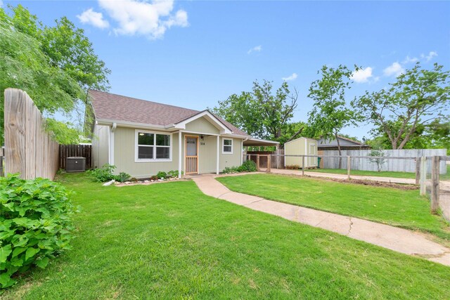 view of front of home featuring central AC and an attached carport